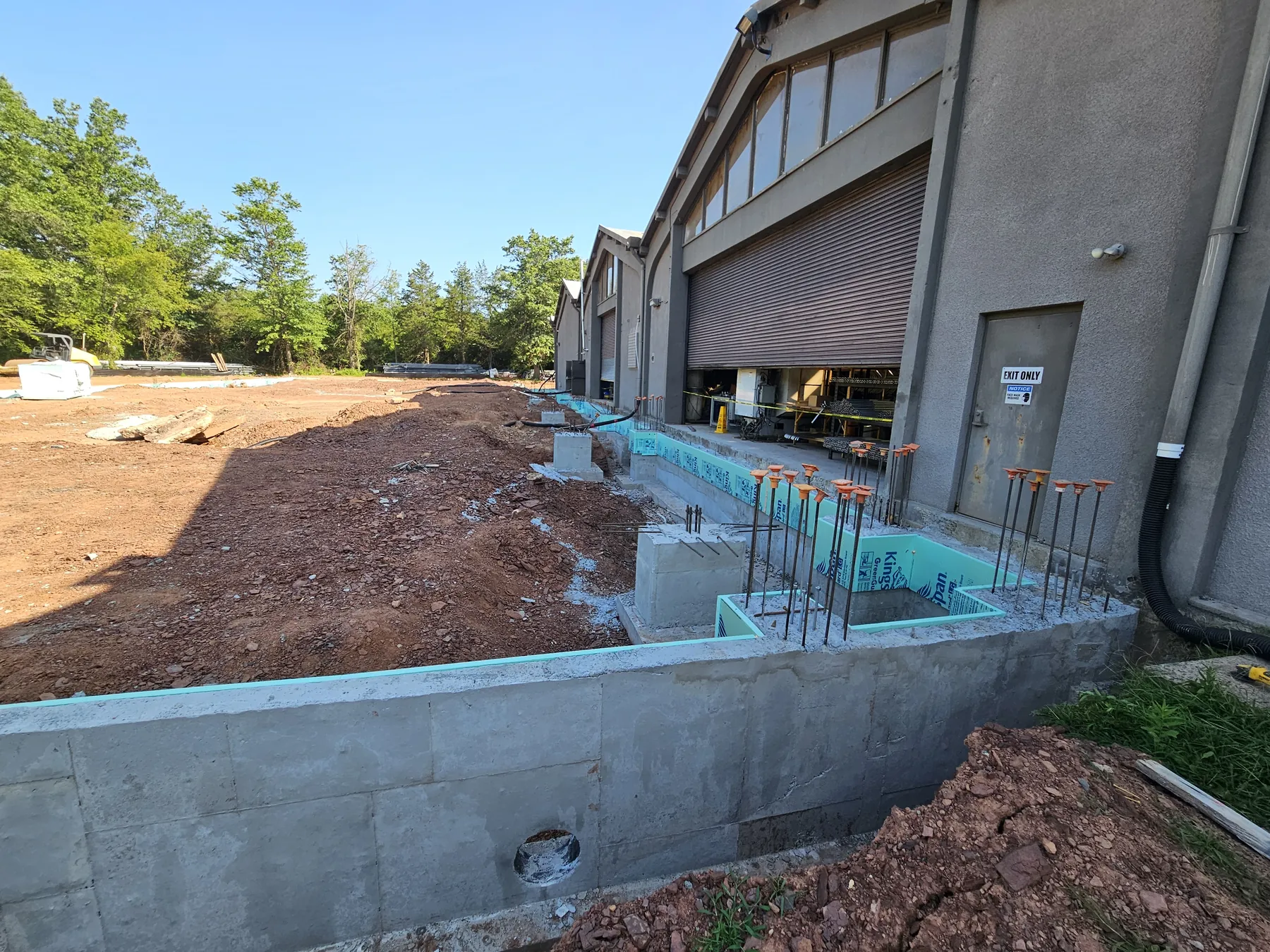 Concrete foundation work for the G&J Steel and Tubing expansion beside the existing industrial facility
