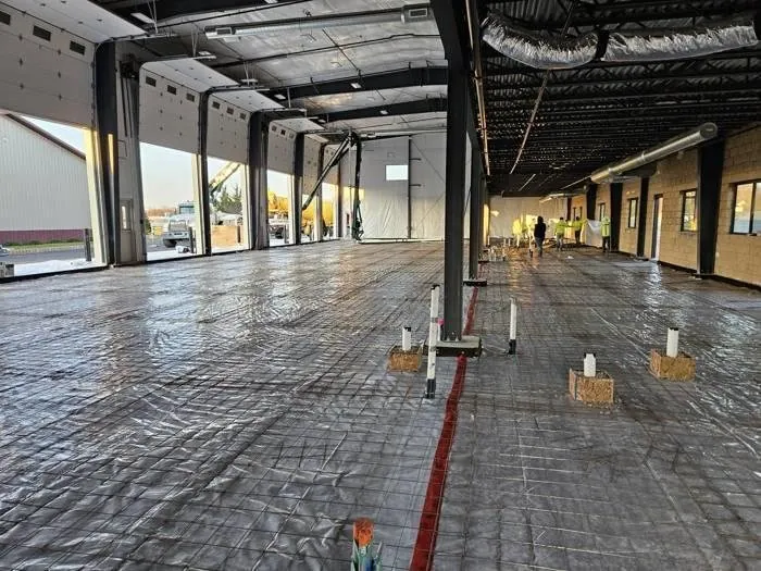 Reinforced commercial concrete slab preparation inside the NEBA Realty steel building