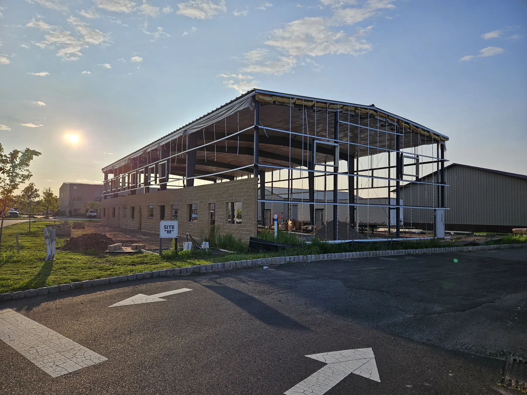 Structural steel and masonry shell under construction at the NEBA Realty trade park building