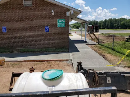 Completed accessible concrete walkway around a Somerset Airport facility