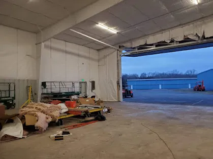 Insulated aircraft hangar interior and large door opening at Somerset Airport after the 2020 improvements